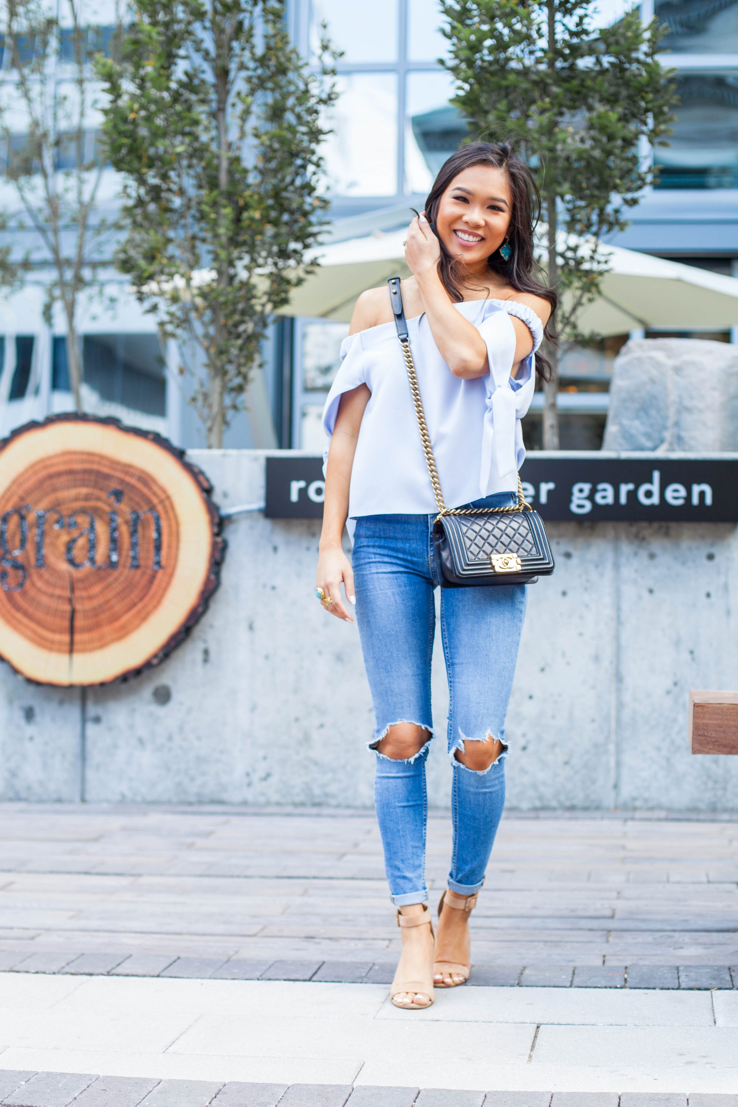COLOR & CHIC | Off the shoulder top with tie sleeves, distressed jeans and Chanel boy bag