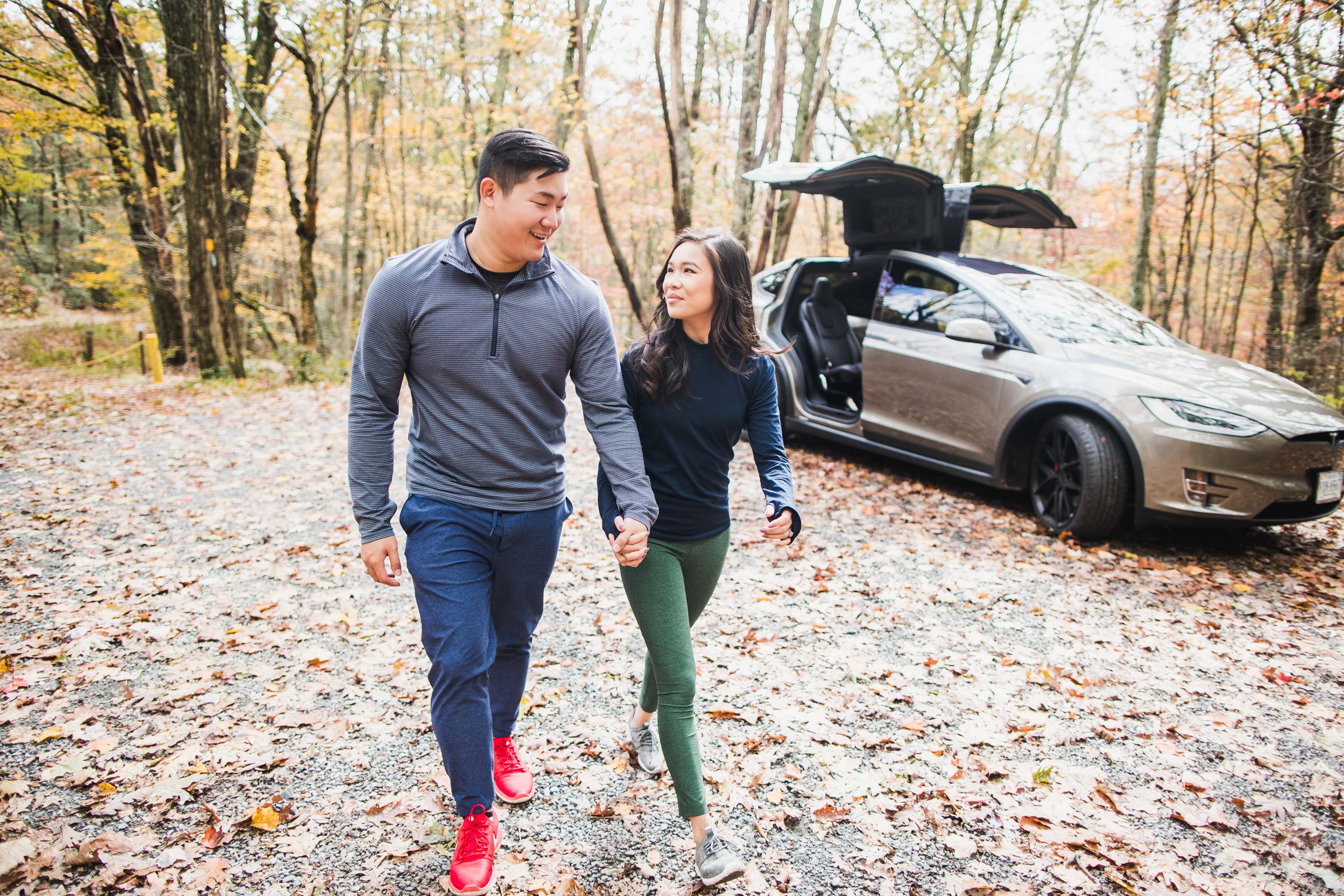 Driving a Tesla Model X into the Virginia Mountains for fall foliage wearing athleisure by Outdoor Voices