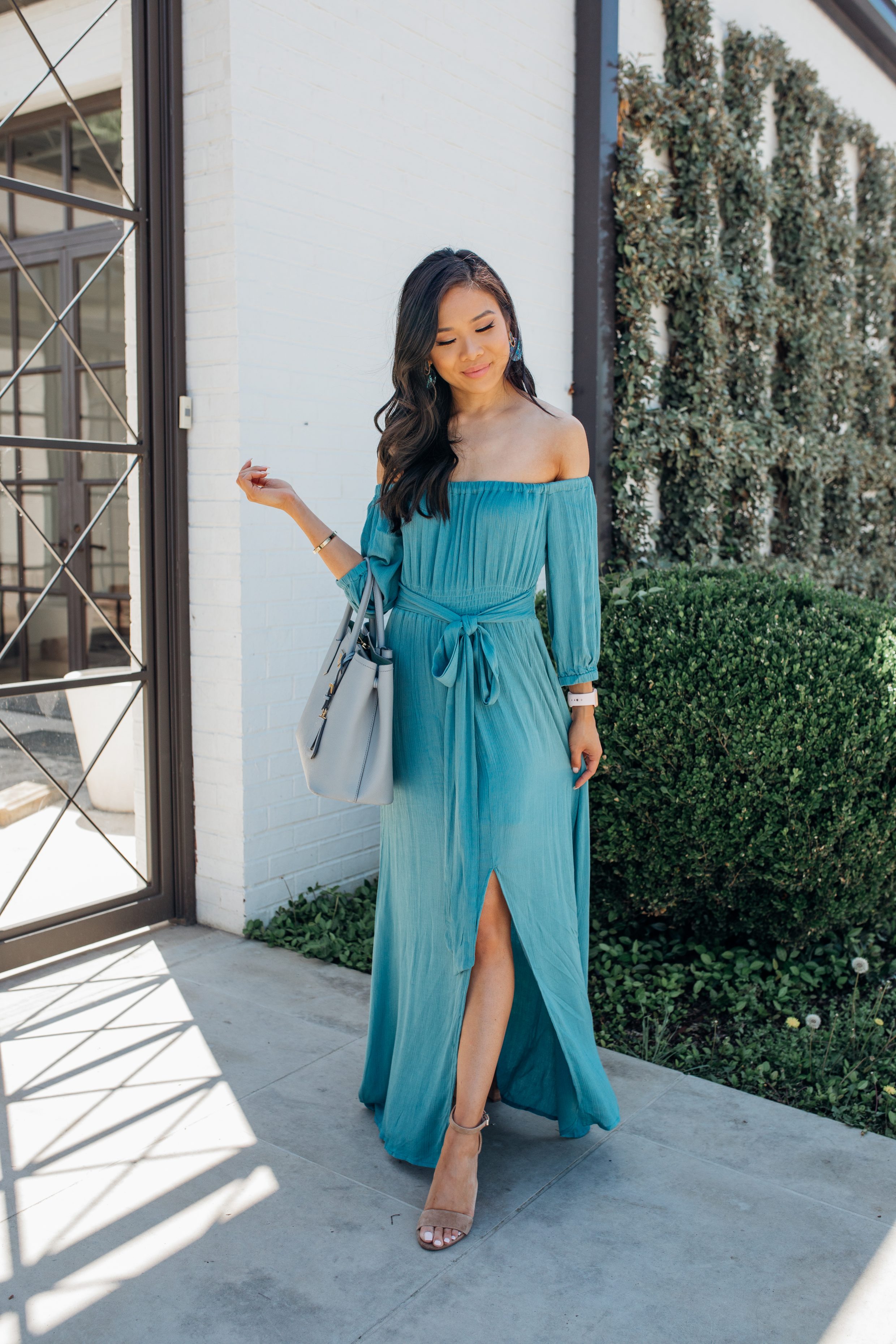Blogger Hoang-Kim wears a teal off-the-shoulder maxi