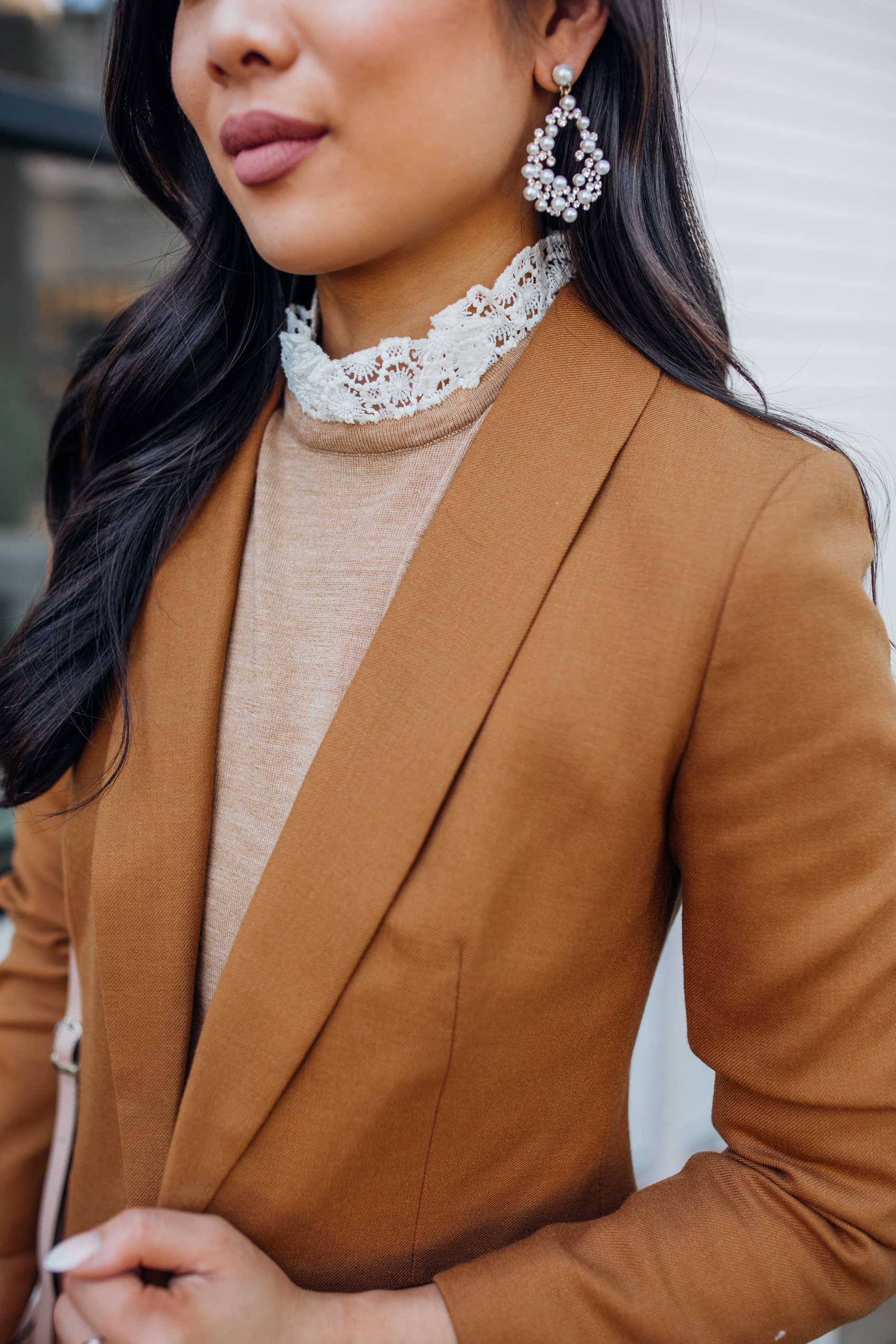 Brown blazer outfit styled with a lace collar merino wool sweater and pearl earrings