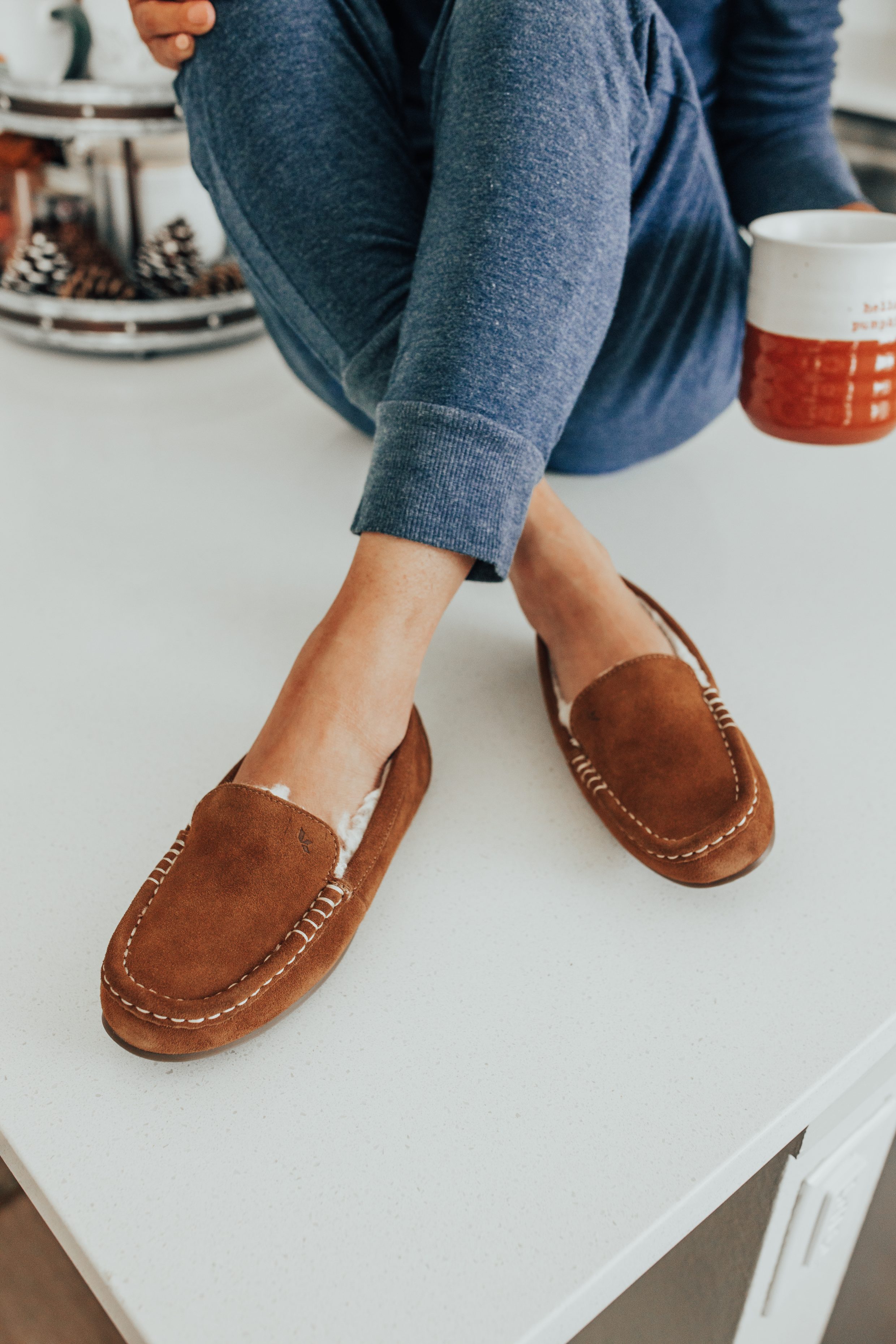 Cozy slippers and pjs for fall with blogger Hoang-Kim in her Dallas apartment with a white kitchen