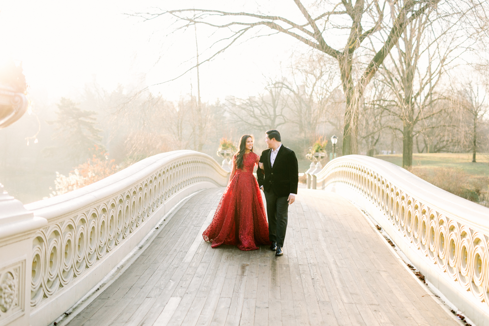 Winter engagement photos shot by Stephanie Sunderland at Bow Bridge in Central Park