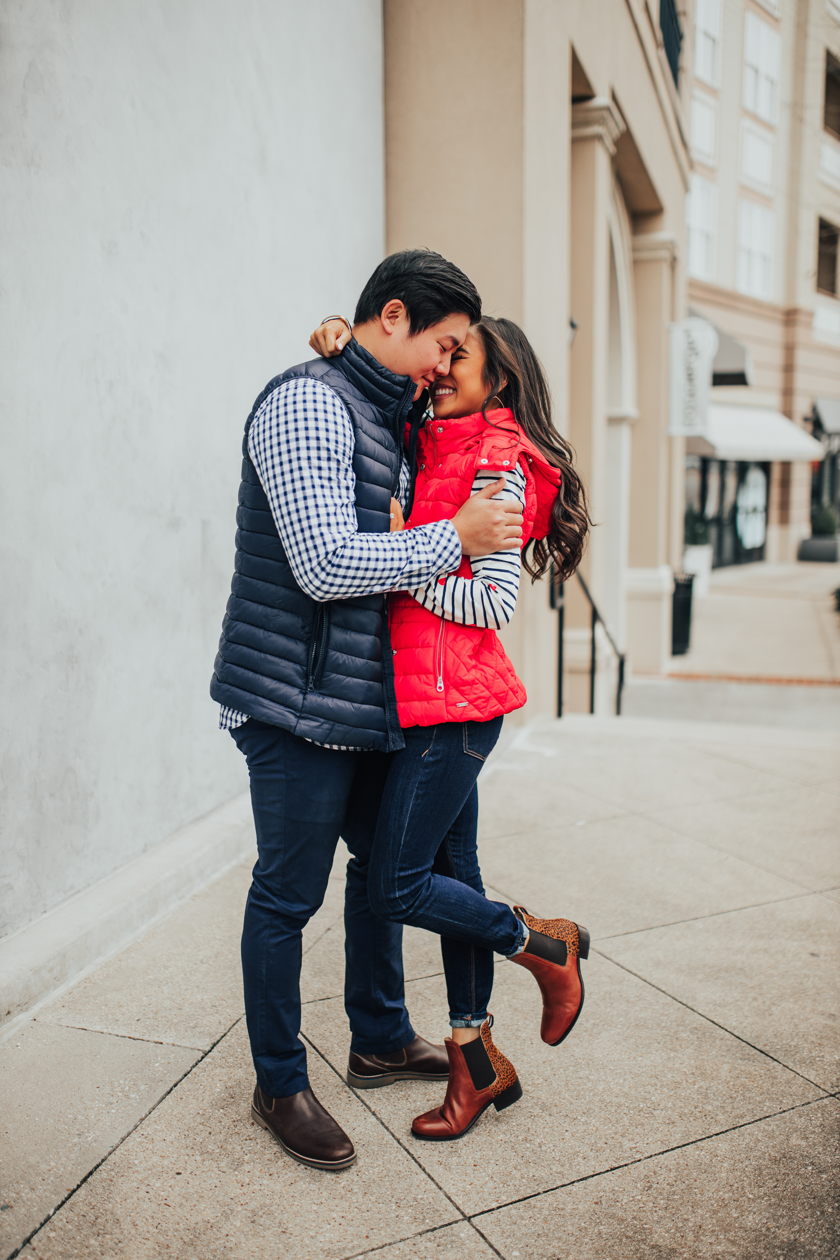 Valentine's Day date night ideas, asian couple wearing Joules USA, check shirt, puffer vest, leopard print chelsea boots