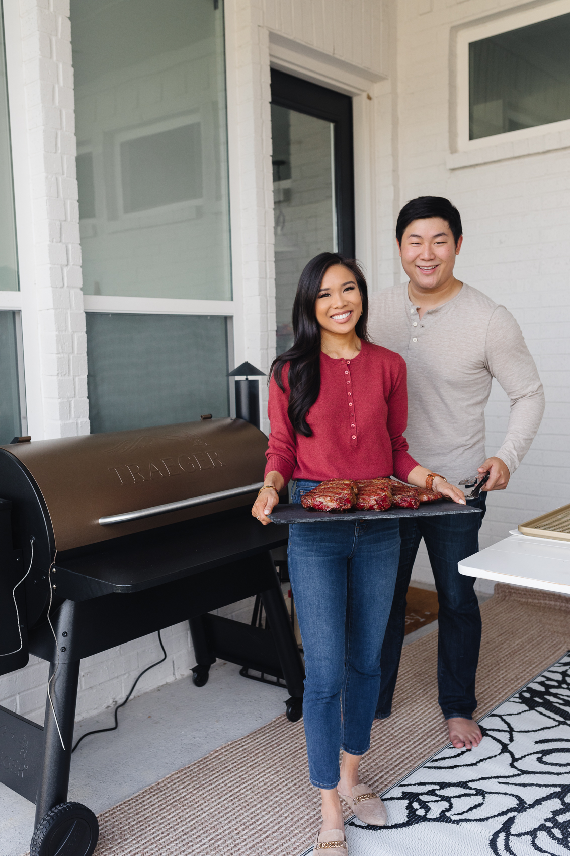 Blogger Hoang-Kim and her fiance Johnny on their backyard patio with the Traegar Pro 34