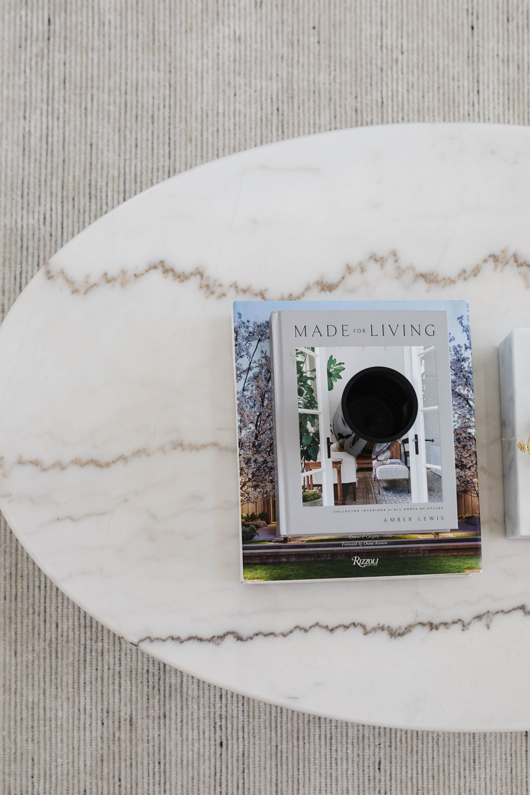 Blogger Hoang-Kim's modern transitional living room reveal, living room coffee table books, arhaus enzo marble coffee table