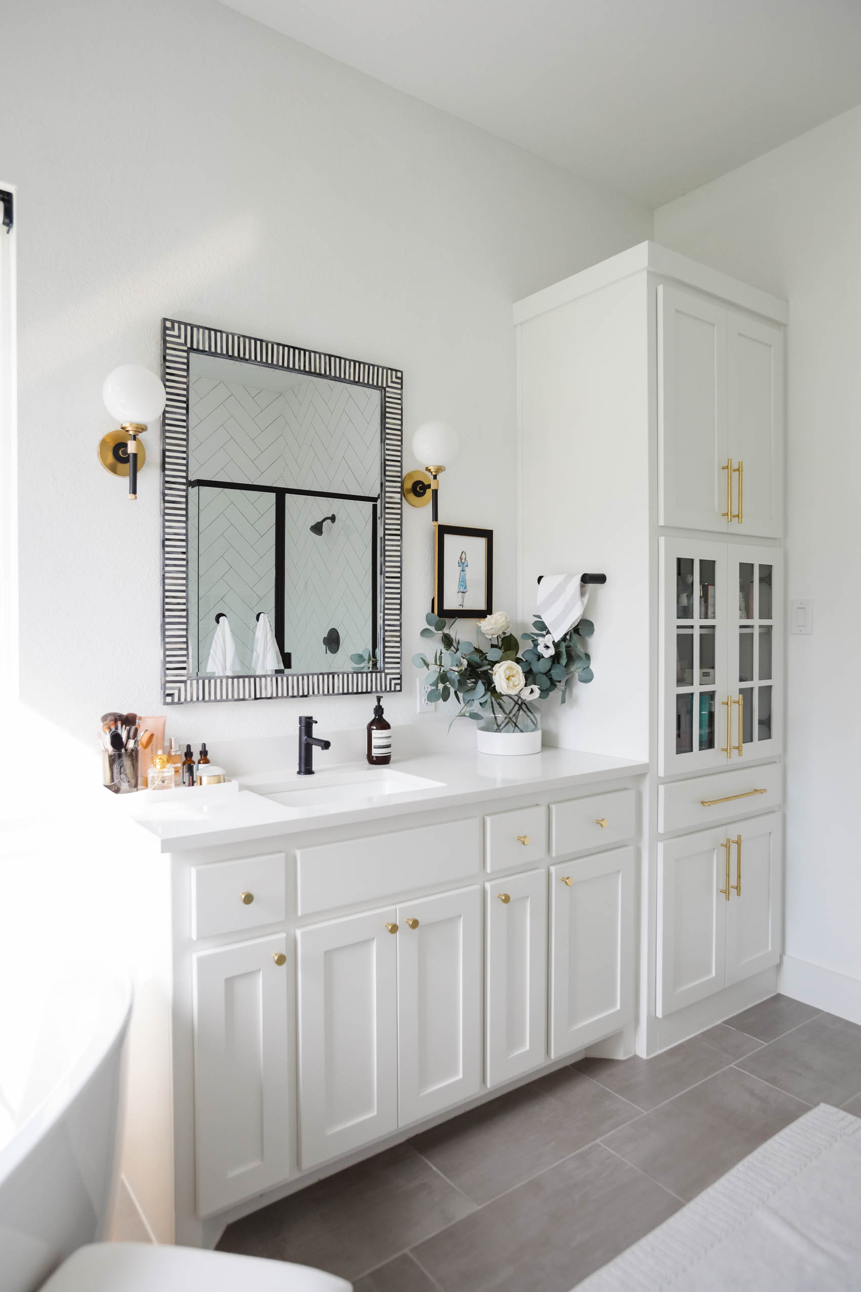 white transitional bathroom and luxury bathroom accessories like the Serena & Lily Bar Harbor Mirror with bone inlay