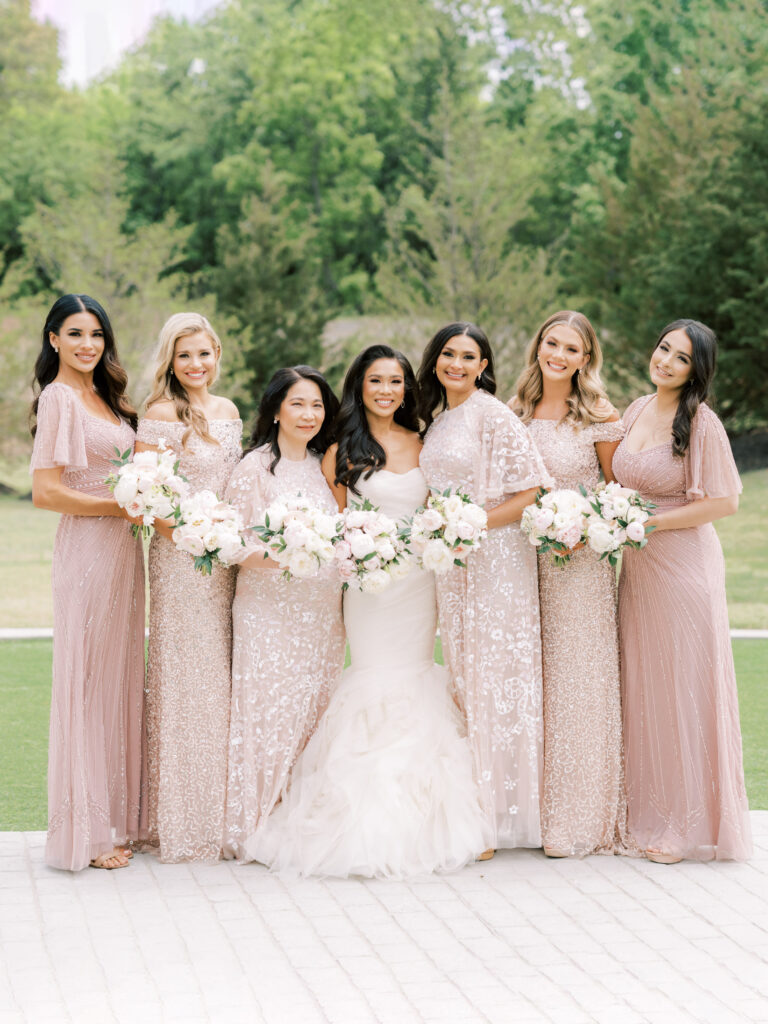 Hoang-Kim Cung and her bridesmaids wearing mix and match bridesmaid dresses from Needle & Thread and Adrianna Papell for her formal black tie wedding