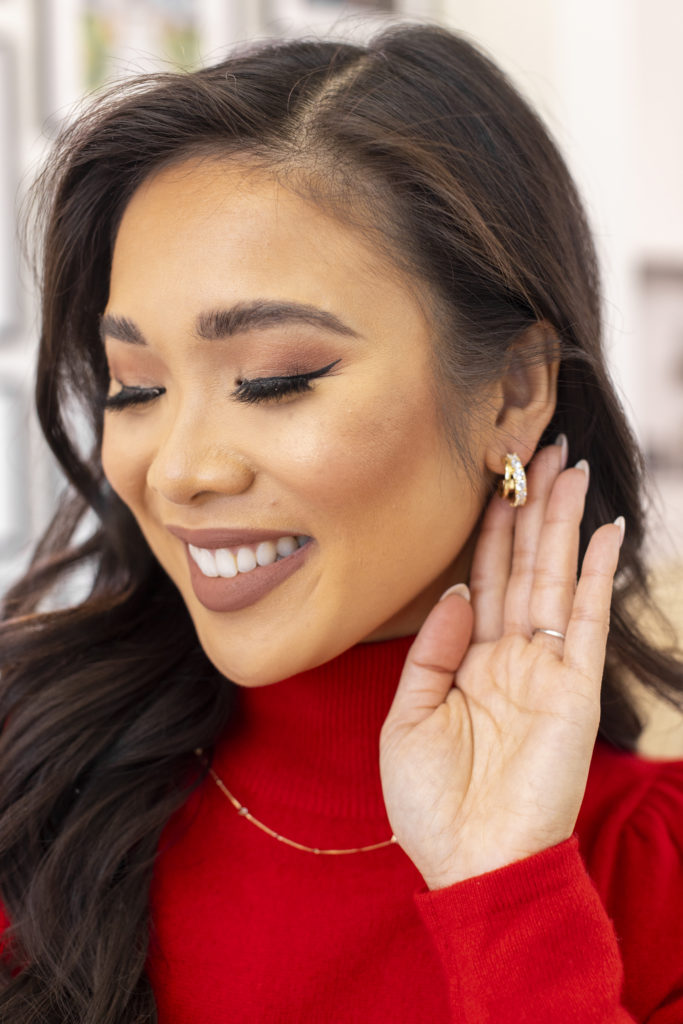 blogger hoang-kim cung styles classic and modern jewelry for the holidays from kendra scott including the livy huggie earrings