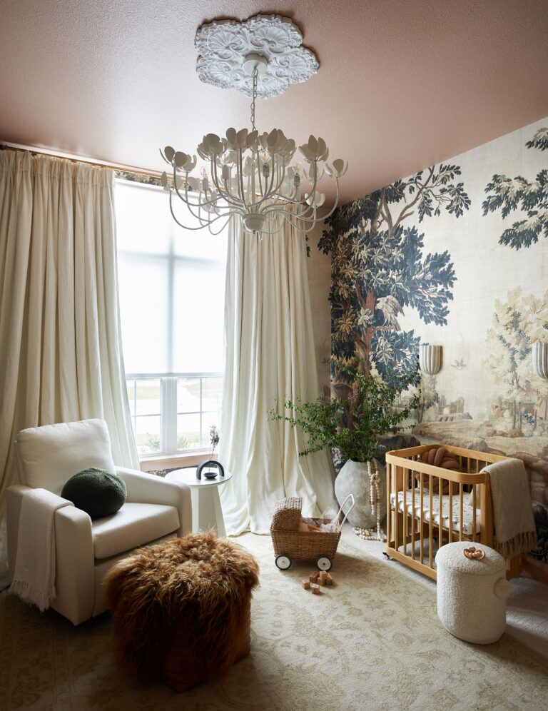 Modern nursery for a girl by Urbanology Designs featuring KEK Amsterdam wallpaper, oilo glider, Nestig crib, balloon drapery and floral chandelier.